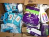 Box of Baby Diapers, Sanitizing Wipes and Cleaning Supplies