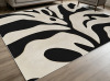 Latitude Run&reg; Black and Beige Abstract Swirl Botanical Area Rug for Living Room, Soft and Comfortable, Suitable for all Seasons, Easy-to-Maintain, Machine Washable, 8' x 10' $399