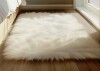 Everly Quinn Haja Fluffy Faux Sheepskin Fur Shag Area Rug in White, 2' x 5' $99